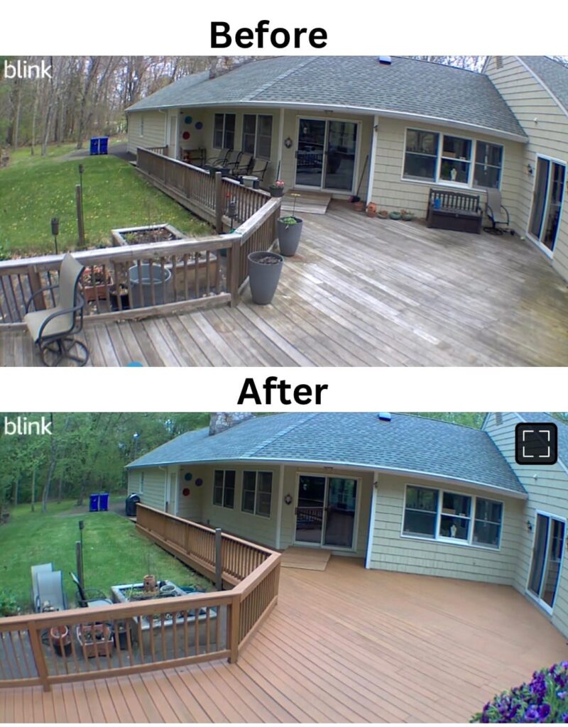 A renovated backyard deck with new wooden flooring and railing.